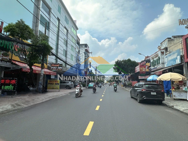 Tòa nhà 7 tầng mtkd sầm uất lê đức thọ 88m2 ngang 4m view góc đẹp ngay chợ cc 22.9 tỷ.